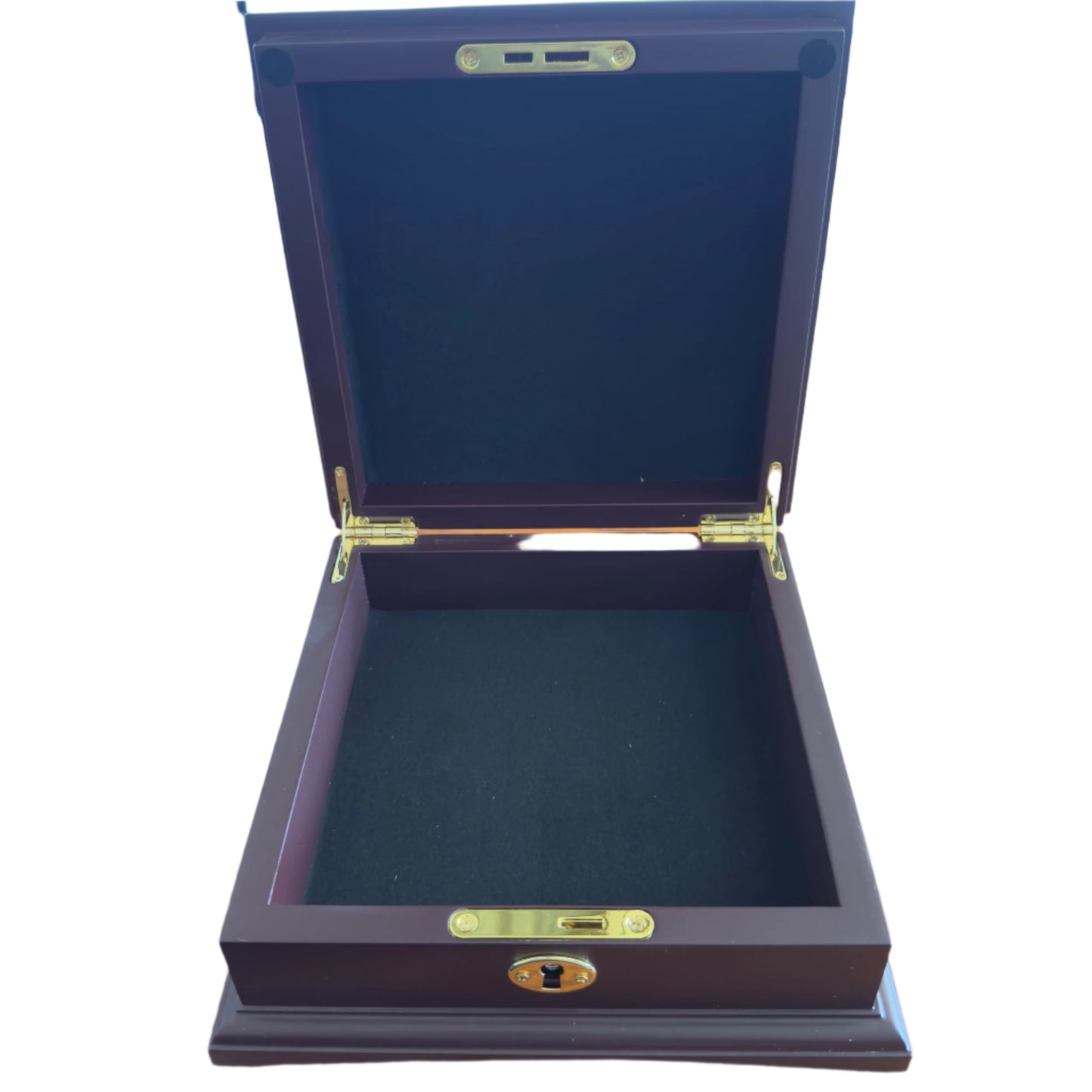 Wooden jewelry box with gold accents on a desk